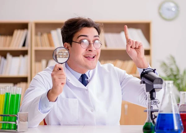 Mad crazy scientist doctor doing experiments in a laboratory — Stock Photo, Image