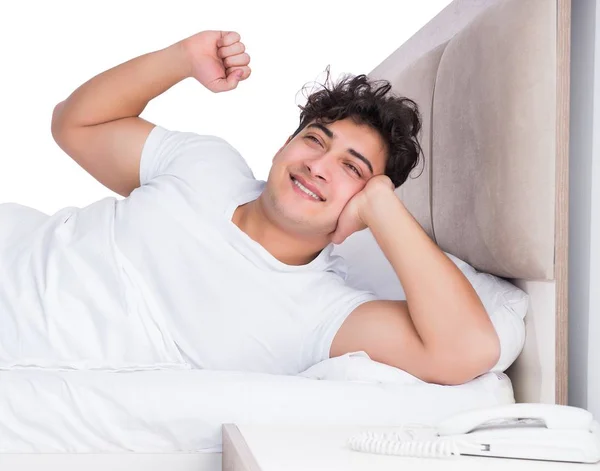 Man in bed suffering from insomnia