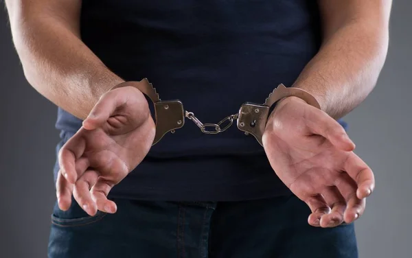 Man with his hands handcuffed in criminal concept — Stock Photo, Image