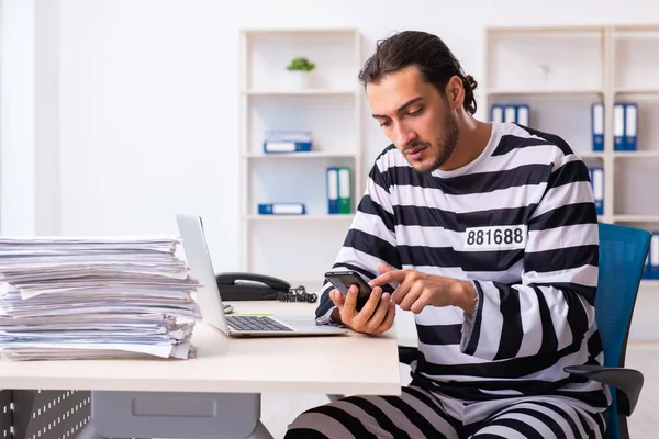 Young employee feeling like prisoner at work — Stock Photo, Image