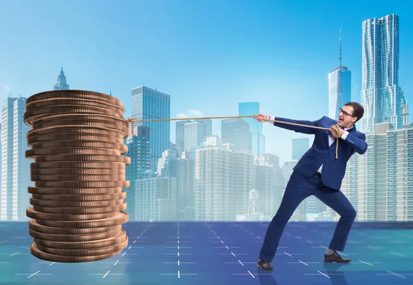 Businessman pulling stack of gold coins — Stock Photo, Image