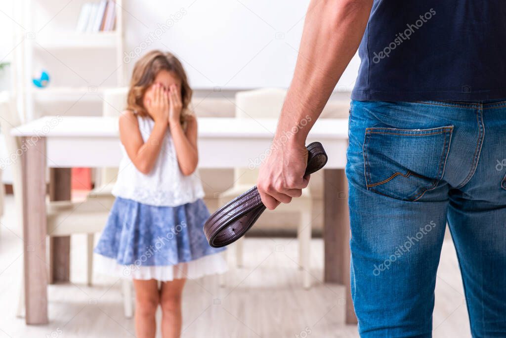 Angry father punishing his daughter