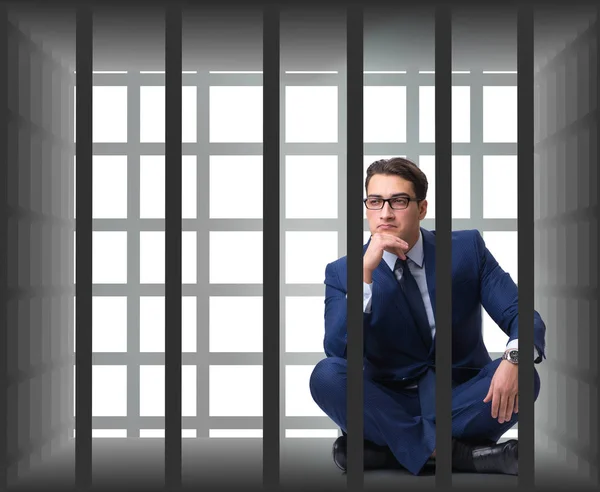 Uomo d'affari nella gabbia isolato su bianco — Foto Stock