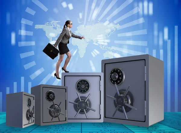 Businesswoman walking on top of safe — Stock Photo, Image