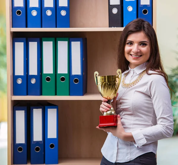 Young businesswoman standing next to shelf — Stock Photo, Image