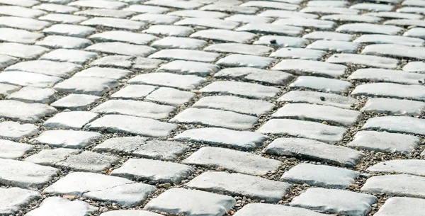 Estrada pavimentada com pedras de calhau para o seu fundo — Fotografia de Stock