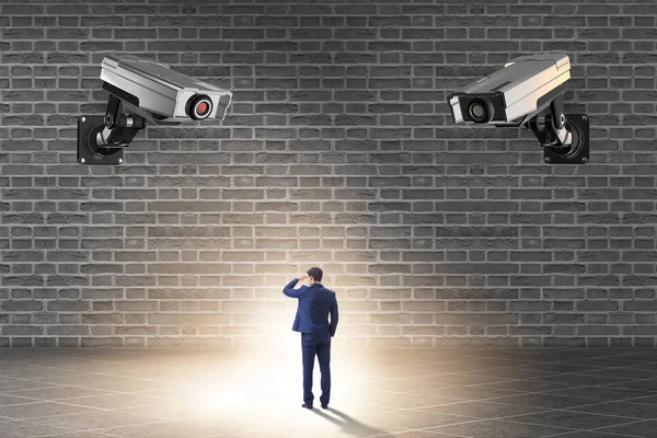 Cameras wathing man in spying concept — Stock Photo, Image