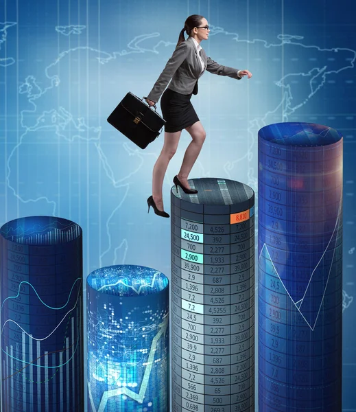 Businesswoman walking over bar charts — Stock Photo, Image