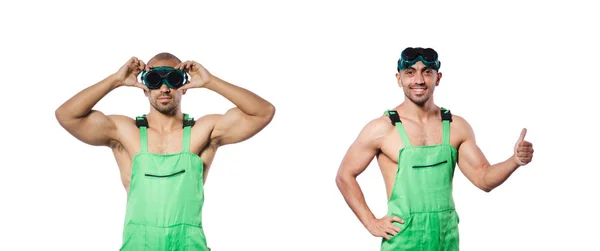 Человек в зеленом комбинезоне с очками — стоковое фото