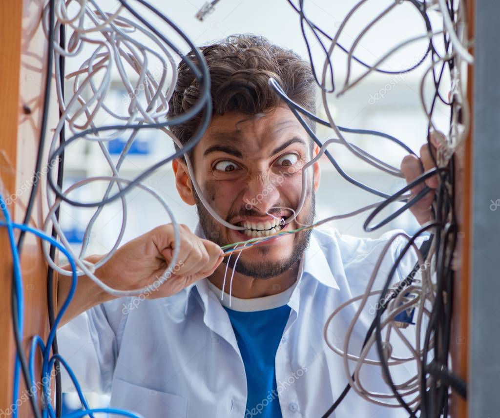 Electrician trying to untangle wires in repair concept