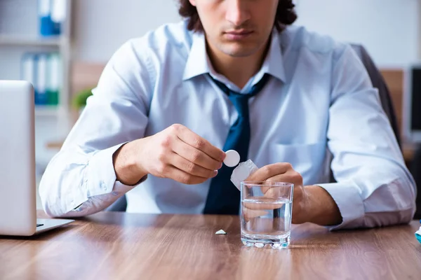 Sick male employee suffering in the office — Stock Photo, Image