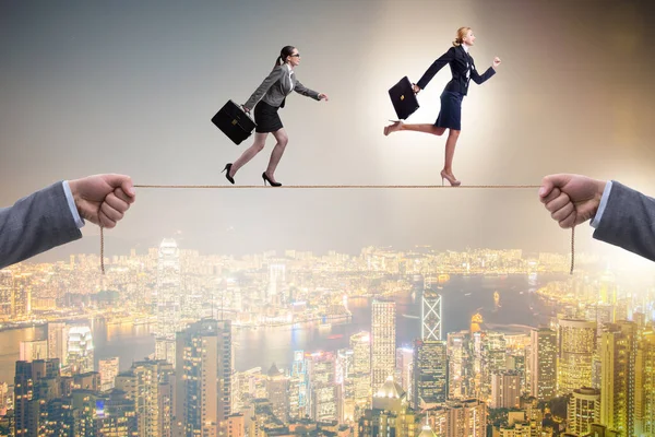 Businesswoman walking on tight rope — Stock Photo, Image