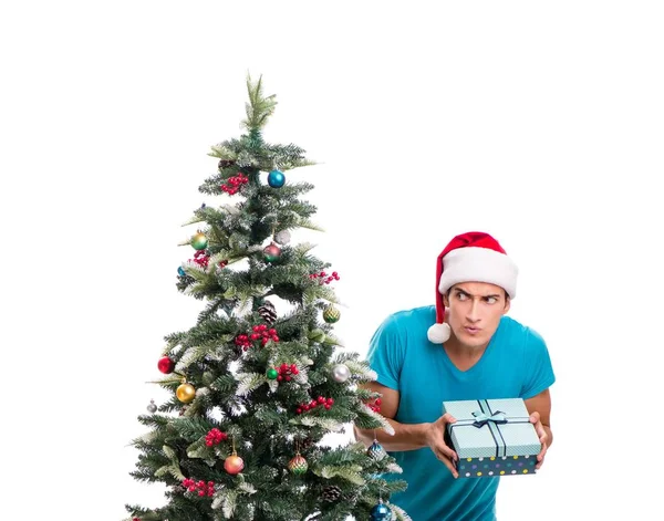 Hombre joven decorando árbol de Navidad aislado en blanco —  Fotos de Stock