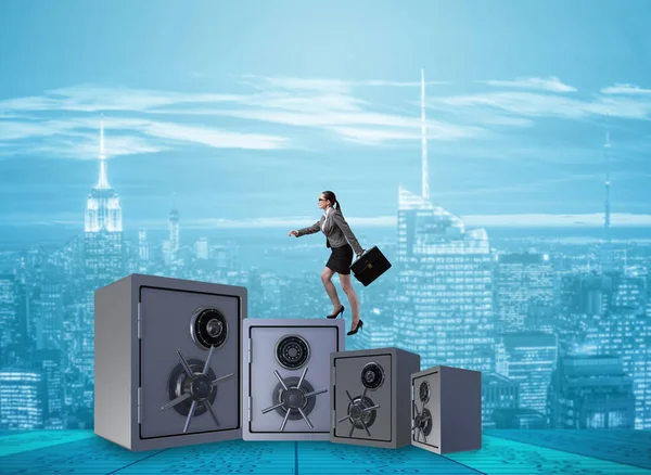 Businesswoman walking on top of safe — Stock Photo, Image