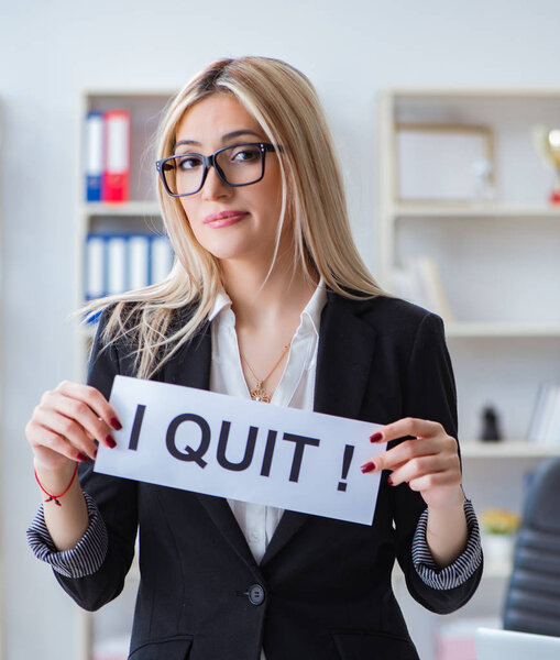 Young businesswoman with message in the office