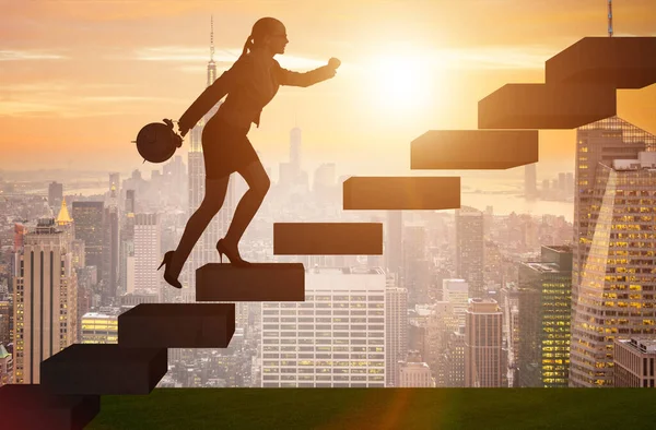 Businesswoman in career growth concept with stairs — Stock Photo, Image