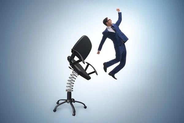 Promotion concept with businessman ejected from chair — Stock Photo, Image