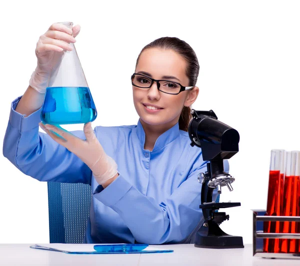 Lab chemist working with microscope and tubes — Stock Photo, Image