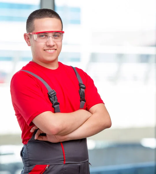 Young furniture carpenter in industrial concept — Stock Photo, Image