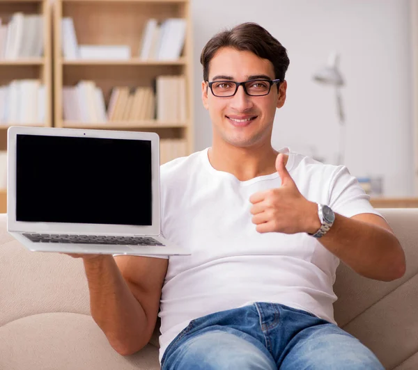 Man working sitting in couch sofa — Stock Photo, Image