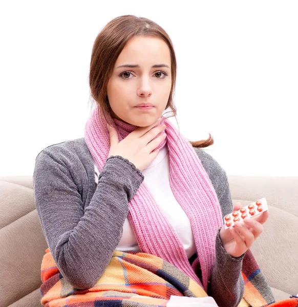 Teenager suffering from cold sitting on coach — Stock Photo, Image