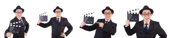 Zabawny człowiek w elegancki garnitur z filmu clapboard na białym tle — Zdjęcie stockowe