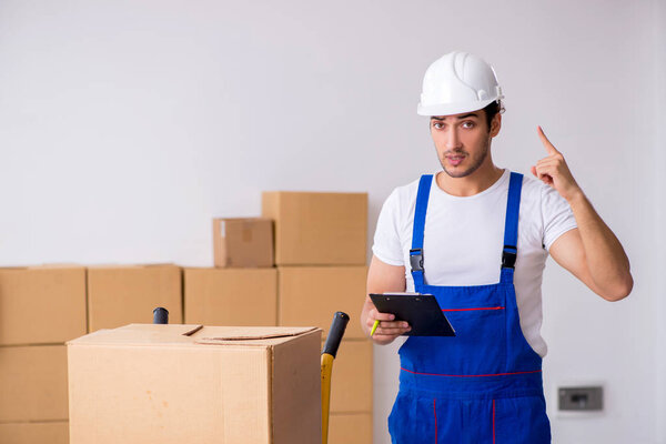 Young male professional mover doing home relocation