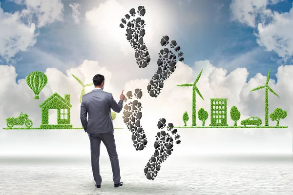 Carbon footprint concept met zakenman — Stockfoto