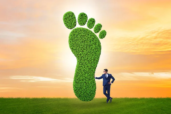Carbon footprint concept with businessman — 스톡 사진