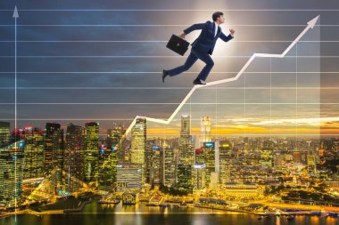 Businessman climbing bar charts in growth concept clipart