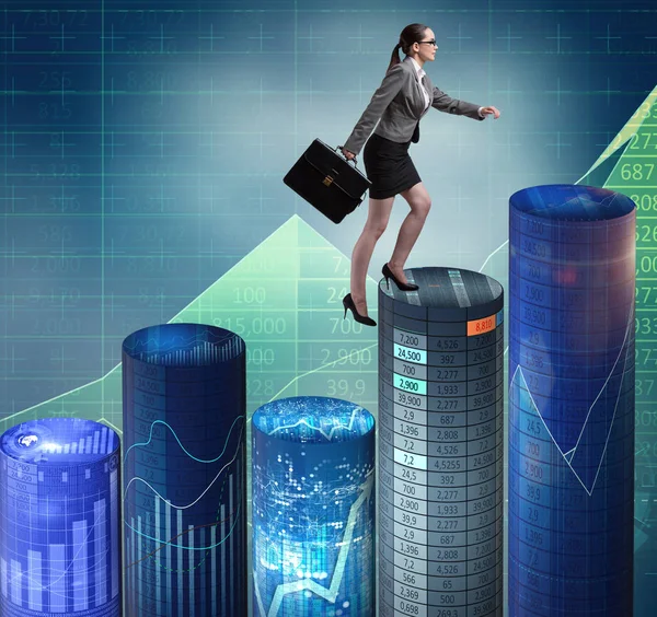 Businesswoman walking over bar charts — Stock Photo, Image