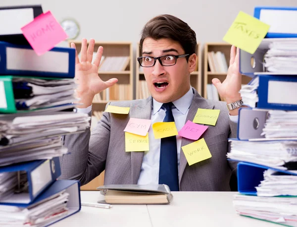 Businessman struggling with multiple priorities — Stock Photo, Image