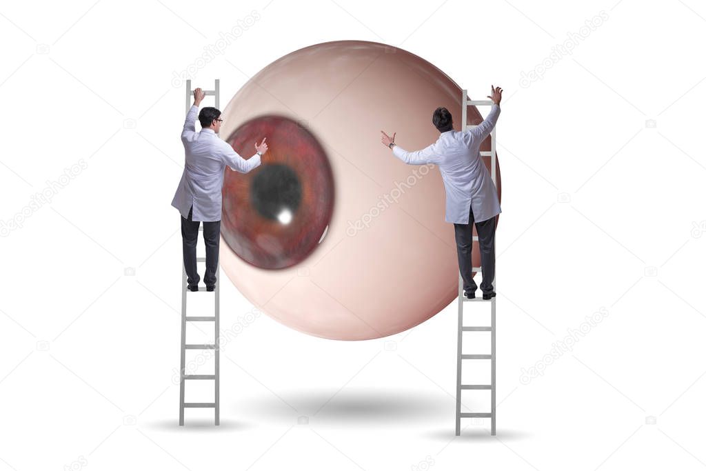 Doctor examining giant eye in medical concept