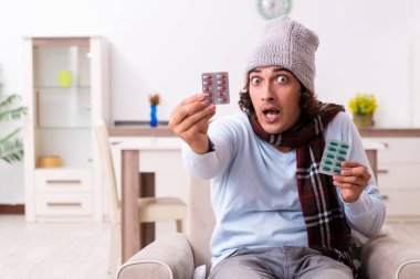 Genç adam evde grip olmuş.