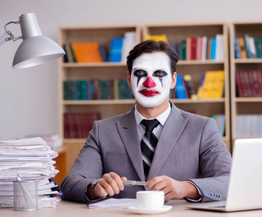 Clown businessman working in the office clipart