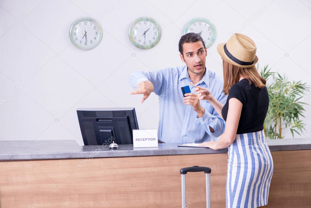 Young woman at hotel reception