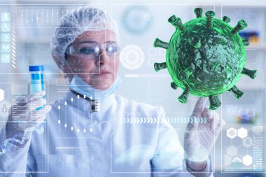 Doktor laboratuvarda koronavirüs araştırması yapıyor.