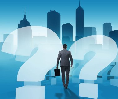 Soru işaretleriyle belirsizlik konseptinde iş adamı