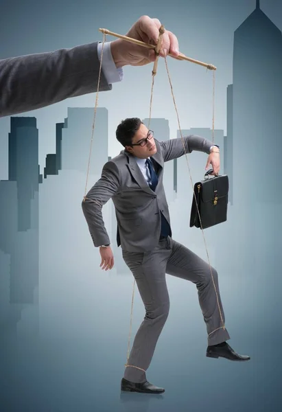 Businessman puppet being manipulated by boss — Stock Photo, Image