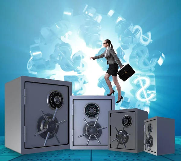 Businesswoman walking on top of safe — Stock Photo, Image