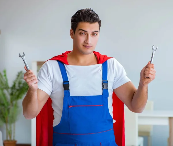 Super hero repairman working at home — Stock Photo, Image