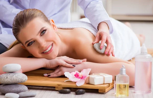 Young woman during spa procedure in salon