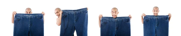 Homem em dieta conceito com jeans de grandes dimensões — Fotografia de Stock