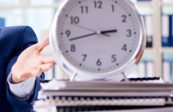 Businessman with giant clock failing to meet deadlines and missi — Stock Photo, Image