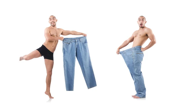 Homem em dieta conceito com jeans de grandes dimensões — Fotografia de Stock