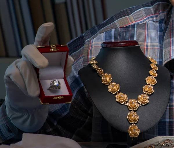 Young male jeweller working at night in his workshop — Stock Photo, Image