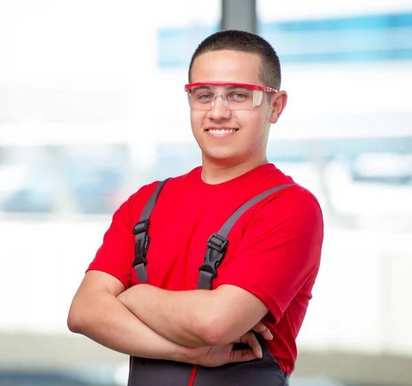 Young furniture carpenter in industrial concept — Stock Photo, Image