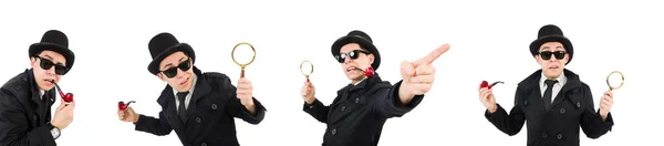 Jonge detective in zwarte jas houden vergrootglas geïsoleerd — Stockfoto