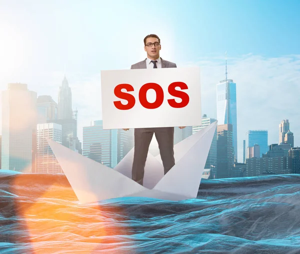 Businessman asking for help with SOS message on boat