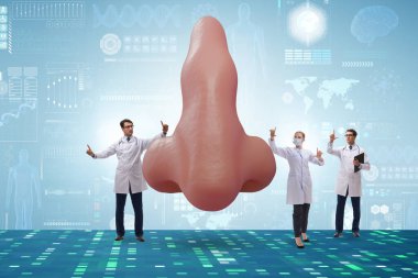 Doktorlar estetik burun ameliyatı yapıyor.